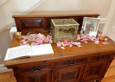 Danielle & Michael's wedding guest sign in and card table decorated with flowers