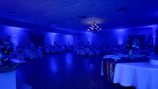 Image of luxury ballroom illuminated in blue uplighting